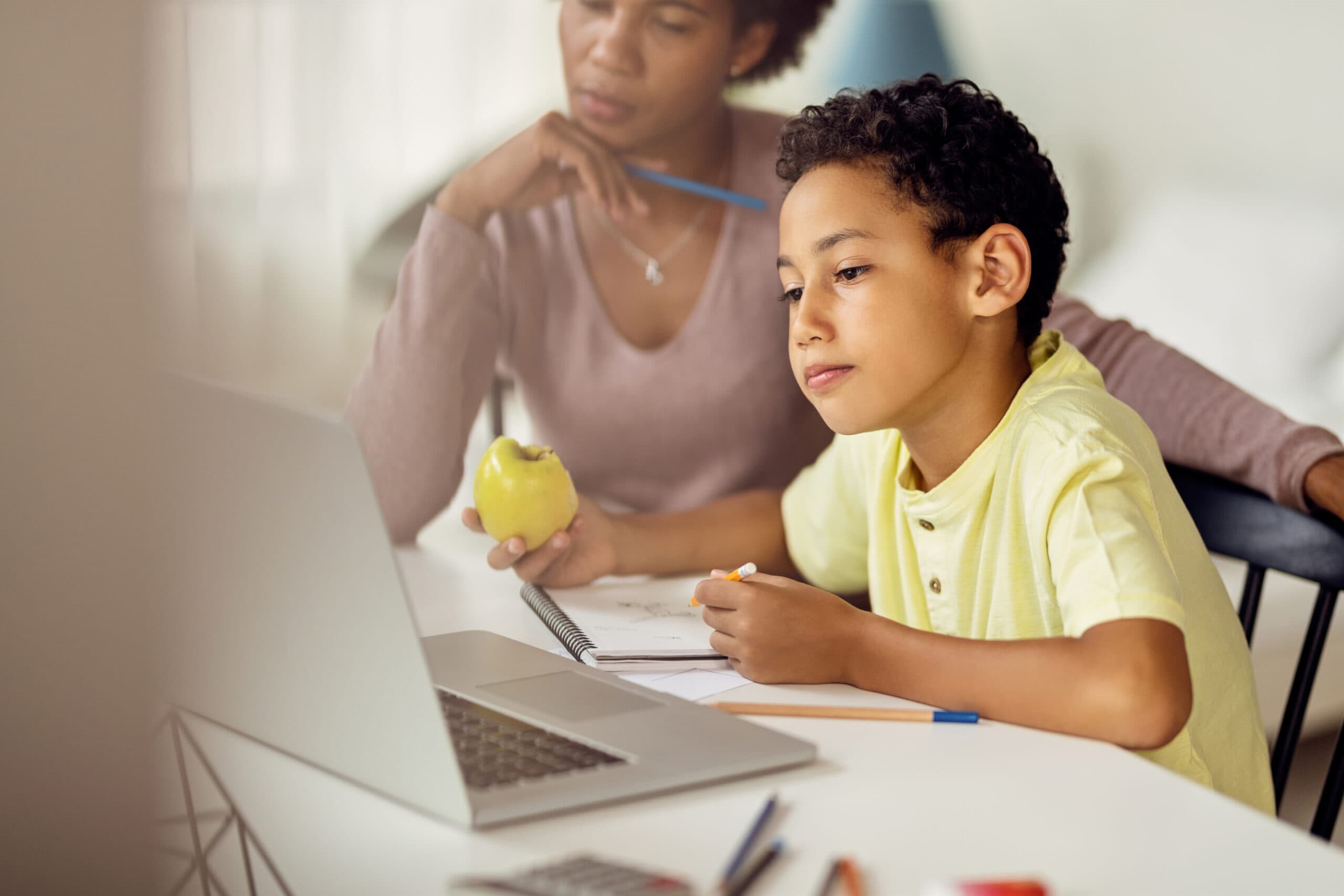 A teacher watching a child study